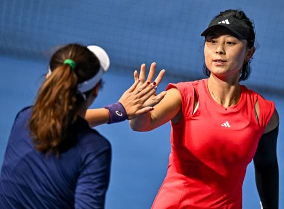 (250210) -- DOHA, Feb. 10, 2025 -- Xu Yifan (R) Yang Zhaoxuan celebrate scoring during women s doubles round of 32 match between Xu Yifan Yang Zhaoxuan of China and Bethanie Mattek-Sands (the United States) Lucie Safarova (the Czech Republic) at the WTA, Tennis Damen Qatar Open tennis tournament in Doha, Qatar, on Feb. 9, 2025. (Photo by Xinhua) (SP)QATAR-DOHA-TENNIS-WTA-QATAR OPEN Nikku 
