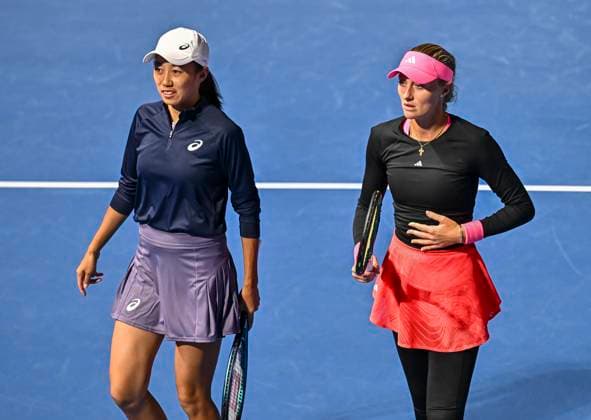 (250211) -- DOHA, Feb. 11, 2025 -- Kristina Mladenovic (R) Zhang Shuai of China react during the women s doubles round of 32 match between Kristina Mladenovic (France) zhang Shuai (China) and Alexandra Panova Fanny Stollar of Hungary at the WTA, Tennis Damen Qatar Open tennis tournament in Doha, Qatar, on Feb. 10, 2025. (Photo by Xinhua) (SP)QATAR-DOHA-TENNIS-WTA-QATAR OPEN Nikku 