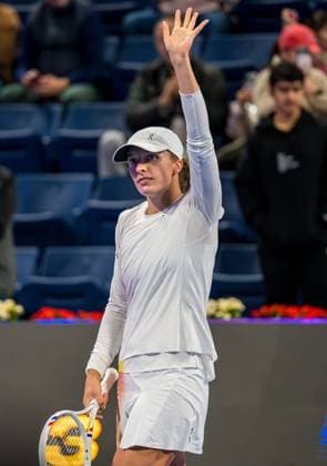 (250211) -- DOHA, Feb. 11, 2025 -- Iga Swiatek of Poland celebrates after winning the women s singles round of 32 match against Maria Sakkari of Greece at the WTA, Tennis Damen Qatar Open tennis tournament in Doha, Qatar, on Feb. 10, 2025. (Photo by Xinhua) (SP)QATAR-DOHA-TENNIS-WTA-QATAR OPEN Nikku 