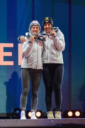 ALPINE SKIING - FIS Ski WC Saalbach 2025 SAALBACH,AUSTRIA,11.FEB.25 - ALPINE SKIING - FIS Alpine World Ski Championships Saalbach 2025, team combined, ladies, medal plaza, award ceremony. Image shows Katharina Truppe and Stephanie Venier (AUT). Keywords: medal.  GEPAxpictures xHaraldxSteiner