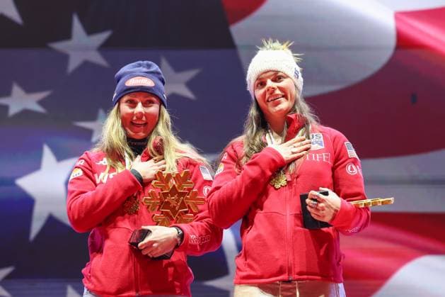 ALPINE SKIING - FIS Ski WC Saalbach 2025 SAALBACH,AUSTRIA,11.FEB.25 - ALPINE SKIING - FIS Alpine World Ski Championships Saalbach 2025, team combined, ladies, medal plaza, award ceremony. Image shows Mikaela Shiffrin and Breezy Johnson (USA). Keywords: trophy.  GEPAxpictures xHaraldxSteiner