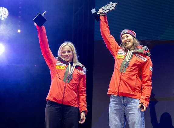 ALPINE SKIING - FIS Ski WC Saalbach 2025 SAALBACH,AUSTRIA,11.FEB.25 - ALPINE SKIING - FIS Alpine World Ski Championships Saalbach 2025, team combined, ladies, medal plaza, award ceremony. Image shows Lara Gut-Behrami and Wendy Holdener (SUI). Keywords: medals and trophies.  GEPAxpictures xHaraldxSteiner
