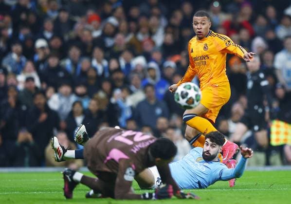 Kylian Mbappe of Real Madrid has their shot saved by Manchester City goalkeeper Ederson Manchester City v Real Madrid, UEFA Champions League, Knockout Round Play-offs, First Leg, Football, Etihad Stadium, Manchester, UK - 11 Feb 2025 EDITORIAL USE ONLY No use with unauthorised audio, video, data, fixture lists, club league logos or live services. Online in-match use limited to 120 images, no video emulation. No use in betting, games or single club league player publications. Copyright: xJavierxGarcia Shutterstockx 15136820v