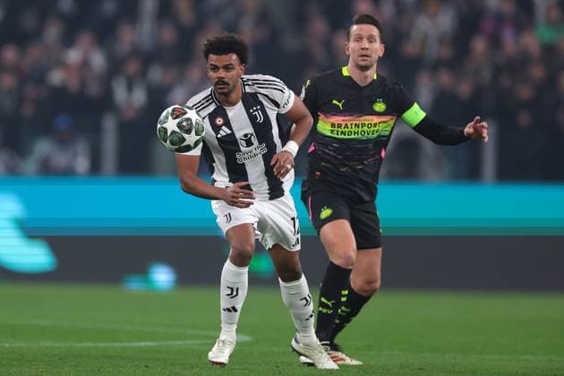 Turin, Italy, 11th February 2025. Renato Veiga of Juventus and Luuk de Jong of PSV Eindhoven during the UEFA Champions League match at Allianz Stadium, Turin. Picture credit should read: Jonathan Moscrop Sportimage EDITORIAL USE ONLY. No use with unauthorised audio, video, data, fixture lists, club league logos or live services. Online in-match use limited to 120 images, no video emulation. No use in betting, games or single club league player publications. SPI_007_JM_JUVE_PSV_UCL SPI-3661-0007