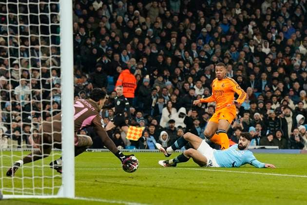 Manchester, England, 11th February 2025. Manchester City™s goalkeeper Ederson saves from Real Madrid s Kylian Mbappe during the UEFA Champions League match at the Etihad Stadium, Manchester. Picture credit should read: Andrew Yates Sportimage EDITORIAL USE ONLY. No use with unauthorised audio, video, data, fixture lists, club league logos or live services. Online in-match use limited to 120 images, no video emulation. No use in betting, games or single club league player publications. SPI_AY_024_Man_City_Real_Madrid SPI-3675-0059