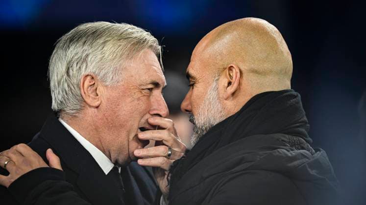 11th February 2025; Etihad Stadium, Manchester, England; UEFA Champions League Play Off Round 1 Football, Manchester City versus Real Madrid; Real Madrid Manager Carlo Ancelotti chats to Manchester City Manager Pep Guardiola  ActionPlus12749755 GodfreyxPitt