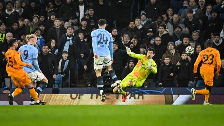 11th February 2025; Etihad Stadium, Manchester, England; UEFA Champions League Play Off Round 1 Football, Manchester City versus Real Madrid; Erling Haaland of Manchester City shoots and scores past Courtois in the 19th minute for 1-0  ActionPlus12749762 GodfreyxPitt