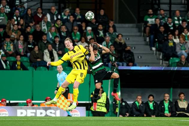 Julian Brandt midfielder of Borussia Dortmund battle for the ball with Maximiliano Araujo forward of Sporting CP during the UEFA Champions League 2024 25 League knockout phase play-offs first leg football match between Sporting CP and Borussia Dortmund at the Jose Alvalade stadium in Lisbon on February 11, 2025. UEFA Champions League - Sporting CP vs Borussia Dortmund (Valter Gouveia SPP) Copyright: xValterxGouveia SPPx spp-en-VaGo-VG_L0430