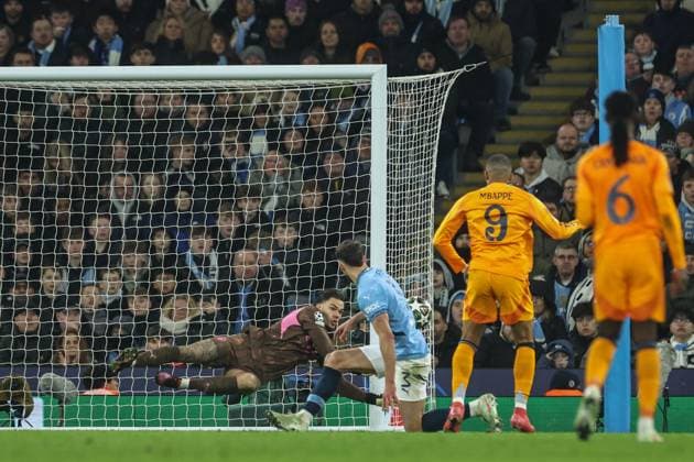 UEFA Champions League Knockout Round Play-off Manchester City v Real Madrid Ederson of Manchester City saves a shot from Kylian MbappÃ of Real Madrid during the UEFA Champions League Knockout Round Play-off Manchester City v Real Madrid at Etihad Stadium, Manchester, United Kingdom, 11th February 2025 (Photo by Mark Cosgrove News Images) Manchester Etihad Stadium Manchester United, ManU Kingdom Copyright: xMarkxCosgrove NewsxImagesx
