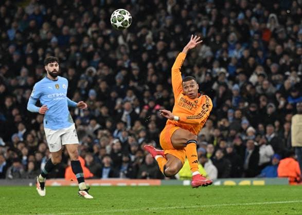 Manchester, England, 11th February 2025. Real Madrid s Kylian Mbappe scoring his sides opening goal during the UEFA Champions League match at the Etihad Stadium, Manchester. Picture credit should read: Cody Froggatt Sportimage EDITORIAL USE ONLY. No use with unauthorised audio, video, data, fixture lists, club league logos or live services. Online in-match use limited to 120 images, no video emulation. No use in betting, games or single club league player publications. SPI_CF_082_Man_City_Real_Madrid SPI-3675-0134