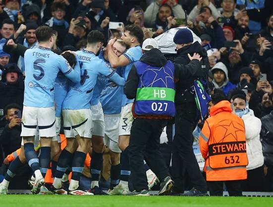 Erling Haaland of Manchester City celebrates scoring a goal from the penalty spot to make it 2-1 with their team-mates Manchester City v Real Madrid, UEFA Champions League, Knockout Round Play-offs, First Leg, Football, Etihad Stadium, Manchester, UK - 11 Feb 2025 EDITORIAL USE ONLY No use with unauthorised audio, video, data, fixture lists, club league logos or live services. Online in-match use limited to 120 images, no video emulation. No use in betting, games or single club league player publications.  Copyright: xJavierxGarcia Shutterstockx 15136820ar