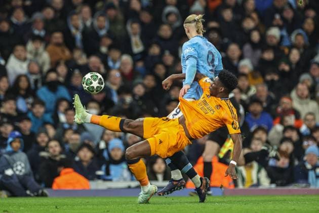 UEFA Champions League Knockout Round Play-off Manchester City v Real Madrid AurÃ lien TchouamÃ ni of Real Madrid wins the ball from Erling Haaland of Manchester City during the UEFA Champions League Knockout Round Play-off Manchester City v Real Madrid at Etihad Stadium, Manchester, United Kingdom, 11th February 2025 (Photo by Mark Cosgrove News Images) Manchester Etihad Stadium Manchester United, ManU Kingdom Copyright: xMarkxCosgrove NewsxImagesx