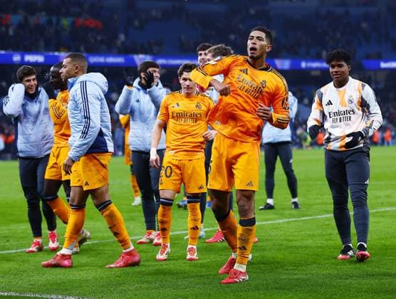 Jude Bellingham of Real Madrid celebrates at the end of the match Manchester City v Real Madrid, UEFA Champions League, Knockout Round Play-offs, First Leg, Football, Etihad Stadium, Manchester, UK - 11 Feb 2025 EDITORIAL USE ONLY No use with unauthorised audio, video, data, fixture lists, club league logos or live services. Online in-match use limited to 120 images, no video emulation. No use in betting, games or single club league player publications.  Copyright: xJavierxGarcia Shutterstockx 15136820bp