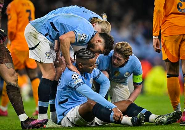 11th February 2025; Etihad Stadium, Manchester, England; UEFA Champions League Play Off Round 1 Football, Manchester City versus Real Madrid; Nathan Ake of Manchester City is injured and his team check on him  ActionPlus12749869 GodfreyxPitt