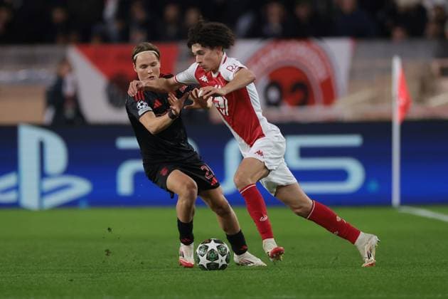 Monaco, Monaco, 12th February 2025. Maghnes Akliouche of AS Monaco takes on Andreas Schjelderup of SL Benfica during the UEFA Champions League match at Stade Louis II, Monaco. Picture credit should read: Simon Bellis Sportimage EDITORIAL USE ONLY. No use with unauthorised audio, video, data, fixture lists, club league logos or live services. Online in-match use limited to 120 images, no video emulation. No use in betting, games or single club league player publications. SPI_005_JM_MONACO_BENFICA_UCL_ SPI-3662-0005