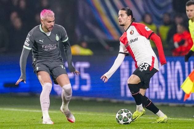 2025-02-12 Feyenoord v AC Milan - UEFA Champions League 2024 25 League Knockout Play-off First Leg ROTTERDAM, NETHERLANDS - FEBRUARY 12: Theo Hernandez of AC Milan battles for possession with Anis Hadj Moussa of Feyenoord during the UEFA Champions League 2024 25 League Knockout Play-off First Leg match between Feyenoord and AC Milan at Stadion Feijenoord on February 12, 2025 in Rotterdam, Netherlands. Rotterdam Stadion Feijenoord Netherlands Content not available for redistribution in The Netherlands directly or indirectly through any third parties. Copyright: xJorisxVerwijstx