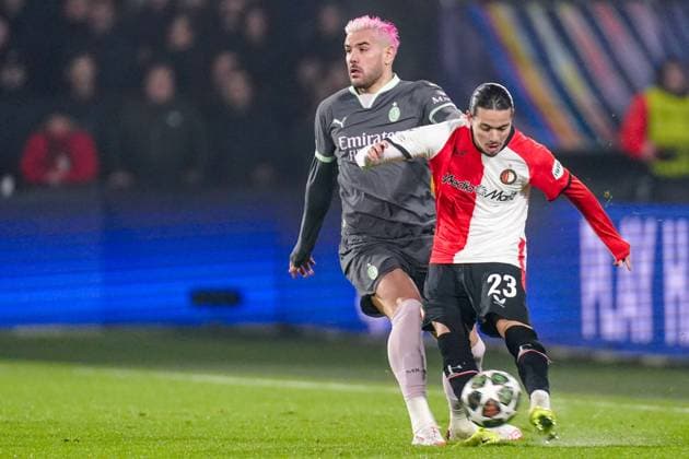 2025-02-12 Feyenoord v AC Milan - UEFA Champions League 2024 25 League Knockout Play-off First Leg ROTTERDAM, NETHERLANDS - FEBRUARY 12: Theo Hernandez of AC Milan battles for possession with Anis Hadj Moussa of Feyenoord during the UEFA Champions League 2024 25 League Knockout Play-off First Leg match between Feyenoord and AC Milan at Stadion Feijenoord on February 12, 2025 in Rotterdam, Netherlands. Rotterdam Stadion Feijenoord Netherlands Content not available for redistribution in The Netherlands directly or indirectly through any third parties. Copyright: xJorisxVerwijstx