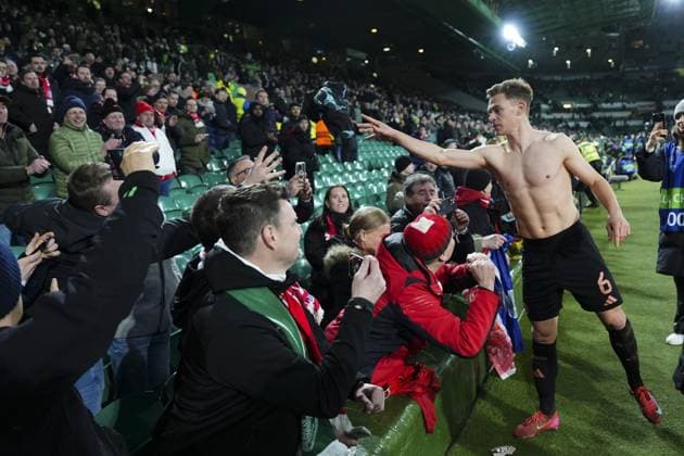 Joshua Kimmich of Bayern Munich throws his jersey into the crowd Celtic v Bayern Munich, UEFA Champions League, Knockout Round Play-offs, First Leg, Football, Celtic Park, Glasgow, UK - 12 Feb 2025 EDITORIAL USE ONLY No use with unauthorised audio, video, data, fixture lists, club league logos or live services. Online in-match use limited to 120 images, no video emulation. No use in betting, games or single club league player publications.  Copyright: xStuartxWallace Shutterstockx 15136907fv