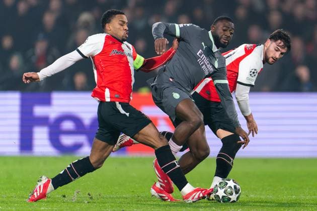2025-02-12 Feyenoord v AC Milan - UEFA Champions League 2024 25 League Knockout Play-off First Leg ROTTERDAM, NETHERLANDS - FEBRUARY 12: Youssouf Fofana of AC Milan battles for the ball with Quinten Timber of Feyenoord and Julian Carranza of Feyenoord during the UEFA Champions League 2024 25 League Knockout Play-off First Leg match between Feyenoord and AC Milan at Stadion Feijenoord on February 12, 2025 in Rotterdam, Netherlands. Rotterdam Stadion Feijenoord Netherlands Content not available for redistribution in The Netherlands directly or indirectly through any third parties. Copyright: xJorisxVerwijstx