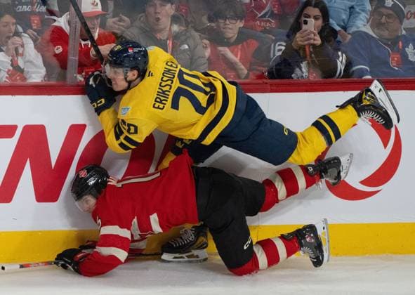 February 12, 2025, Montreal, Pq, CANADA: Canada forward Mitch Marner (bottom) is checked by Sweden forward Joel Eriksson Ek (20) during first period 4 Nations Face-Off hockey action in Montreal on Wednesday, Feb. 12, 2025. Canada News - February 12, 2025  - ZUMAc35_ 20250212_zaf_c35_105 Copyright: xChristinnexMuschix