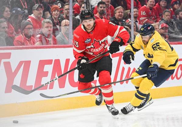 February 12, 2025, Montreal, Pq, Canada: Canada s Sam Reinhart (13) and Sweden s Erik Karlsson (65) battle for the puck during first period 4 Nations Face-Off hockey action in Montreal, Wednesday, February 12, 2025. Sam Reinhart, Erik Karlsson,  - ZUMAc35_ 20250212_zaf_c35_116 Copyright: xGrahamxHughesx