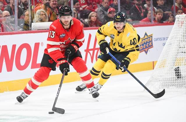 February 12, 2025, Montreal, Pq, Canada: Canada s Sam Reinhart (13) moves the puck away from Sweden s Elias Pettersson (40) during third period 4 Nations Face-Off hockey action in Montreal, Wednesday, February 12, 2025. Sam Reinhart, Elias Pettersson,  - ZUMAc35_ 20250212_zaf_c35_142 Copyright: xGrahamxHughesx