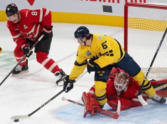 February 12, 2025, Montreal, Pq, CANADA: Canada goaltender Jordan Binnington (50) looks for the puck between the legs of Sweden forward Rickard Rakell (67) as Canada defenceman Cale Makar (8) looks on during overtime 4 Nations Face-Off hockey action in Montreal on Wednesday, Feb. 12, 2025. Canada News - February 12, 2025  - ZUMAc35_ 20250212_zaf_c35_153 Copyright: xChristinnexMuschix