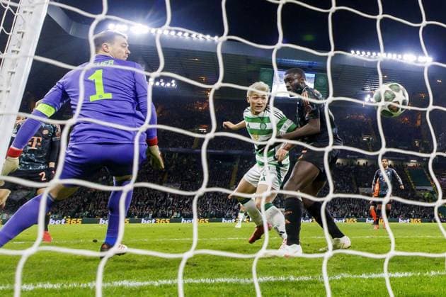 Football: Champions League Daizen Maeda (C) of Celtic scores a goal in the second half of a Champions League football match against Bayern Munich on Feb. 12, 2025, in Glasgow, Scotland.  A14AA0004141917P