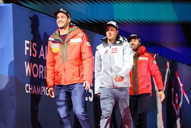 ALPINE SKIING - FIS Ski WC Saalbach 2025 SAALBACH,AUSTRIA,14.FEB.25 - ALPINE SKIING - FIS Alpine World Ski Championships Saalbach 2025, giant slalom, men, medal plaza, award ceremony. Image shows Thomas Tumler (SUI), Raphael Haaser (AUT) and Loic Meillard (SUI).  GEPAxpictures xThomasxBachun