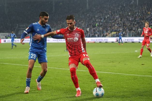 14 02 2025, xgox, Soccer 2 Bundesliga, 1 FC Magdeburg 1 FC Koeln emspor, v l Livian Burcu Magdeburg, 29 , Leart Pacarada Koeln, 17 DFL DFB REGULATIONS PROHIBIT ANY USE OF PHOTOGRAPHS as IMAGE SEQUENCES and or QUASI VIDEO Magdeburg