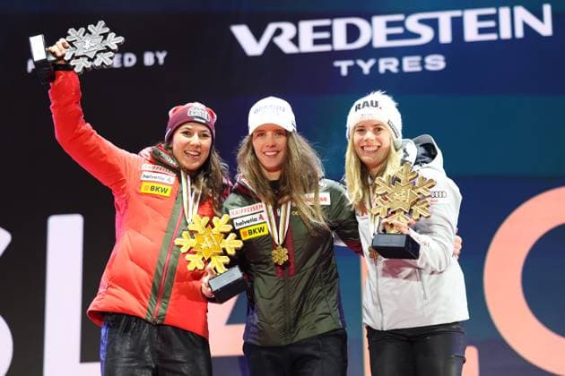 ALPINE SKIING - FIS Ski WC Saalbach 2025 SAALBACH,AUSTRIA,15.FEB.25 - ALPINE SKIING - FIS Alpine World Ski Championships Saalbach 2025, slalom, ladies, medal plaza, award ceremony. Image shows the rejoicing of Wendy Holdener (SUI), Camille Rast (SUI) and Katharina Liensberger (AUT). Keywords: medal.  GEPAxpictures xHaraldxSteiner