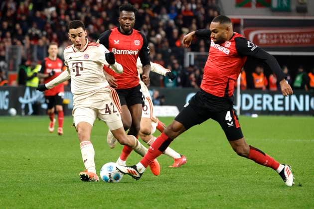 Leverkusen, Germany, Germany 1 Soccer Bundesliga, Season 2024 2025 22 Matchday 22 Bayer 04 Leverkusen FC Bayern Munich 15 02 2025 at the Bay Arena in Leverkusen Jamal MUSIALA FCB left and Jonathan TAH LEV right Photo Norbert Schmidt, Duesseldorf