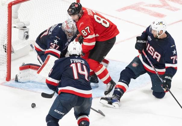 Eishockey, 4 Nations Face-Off in Montreal, Kanada - USA February 15, 2025, Montreal, Pq, CANADA: Canada s Sidney Crosby (87) battles for a rebound in front of United States goaltender Connor Hellebuyck (37) as Brock Faber (14) and Jaccob Slavin (74) defend during third period 4 Nations Face-Off hockey action in Montreal on Saturday, Feb. 15, 2025. Canada News - February 15, 2025  - ZUMAc35_ 20250215_zaf_c35_264 Copyright: xChristinnexMuschix