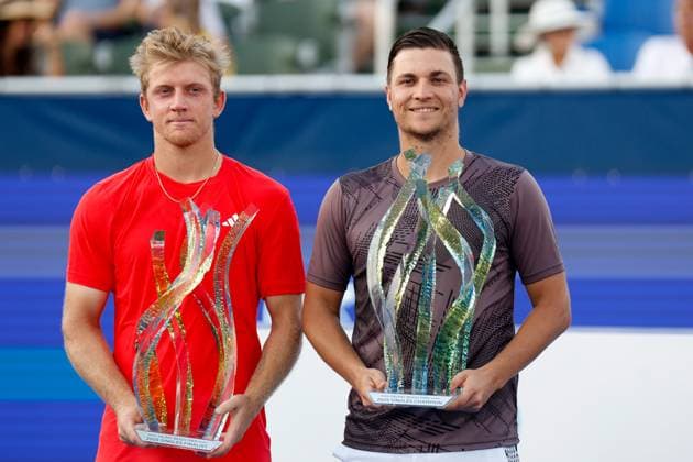 DELRAY BEACH, FL - FEBRUARY 16: Alejandro Davidovich Fokina (ESP) and Miomir Kecmanovic (SRB) show their respective runners up and Championship trophies at the end of the Mens Singles Final at the Delray Beach Open on February 16, 2025, at Delray Beach Stadium & Tennis Center in Delray Beach, Florida.(Photo by Chris Arjoon Icon Sportswire). TENNIS: FEB 16 Delray Beach Open EDITORIAL USE ONLY Icon25021600111