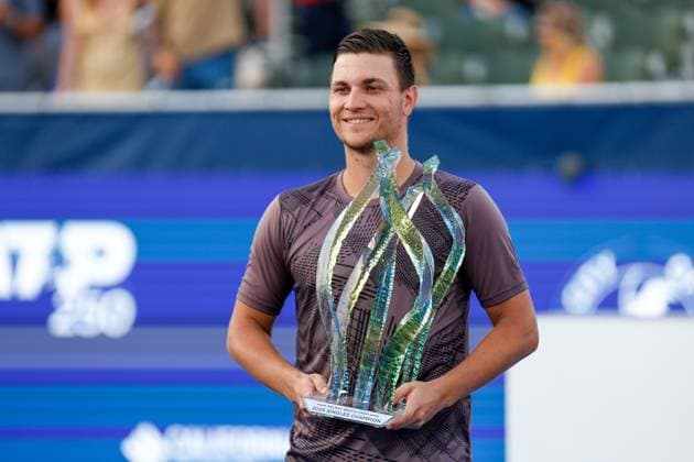 DELRAY BEACH, FL - FEBRUARY 16: Miomir Kecmanovic (SRB) shows his Championship trophy at the end of the Mens Singles Final at the Delray Beach Open on February 16, 2025, at Delray Beach Stadium & Tennis Center in Delray Beach, Florida.(Photo by Chris Arjoon Icon Sportswire). TENNIS: FEB 16 Delray Beach Open EDITORIAL USE ONLY Icon25021600112