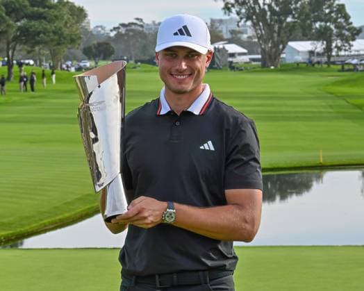 February 16, 2025: Ludvig Aberg holds the championship trophy after winning the Genesis Invitational on Torrey Pines South Course in San Diego, California. CSM San Diego USA - ZUMAc04_ 20250216_zma_c04_041 Copyright: xJustinxFinex