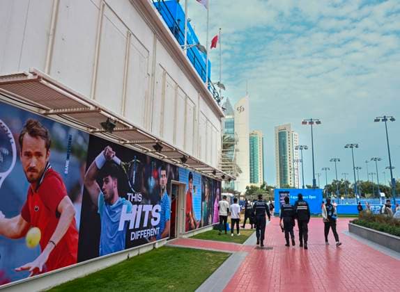 ATP, Tennis Herren QATAR EXXONMOBIL OPEN ROUND OF 32 People walk past posters depicting tennis players on the eve of the ATP Qatar ExxonMobil Open 2025 tennis tournament at the Khalifa International Tennis Complex in Doha, Qatar, on February 17, 2025. DOHA Qatar Copyright: xNOUSHADx