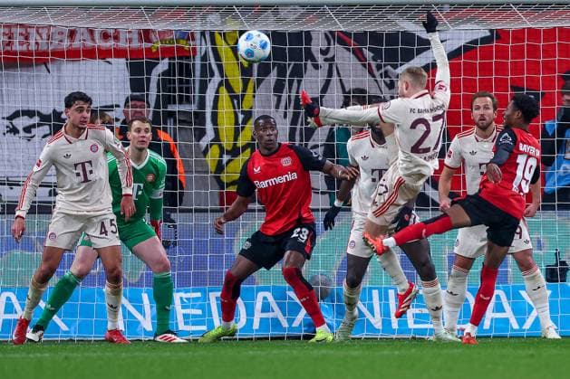 15 02 2025, Football, Bayer 04 Leverkusen FC Bayern München, 1 Soccer Bundesliga, 22 Matchday, BayArena, Season 2024 2025 Aleksandar Pavlovic FC Bayern 45 , Goalkeeper Manuel Neuer FC Bayern 1 , Dayot Upamecano FC Bayern 2 and Konrad Laimer FC Bayern 27 defend in front of goal in the penalty area against Nordi Mukiele Bayer04 Leverkusen 23 and Nathan Tella Bayer04 Leverkusen 19 DFB regulations prohibit any use of photographs as image sequences and or quasi video North Rhine-Westphalia Germany