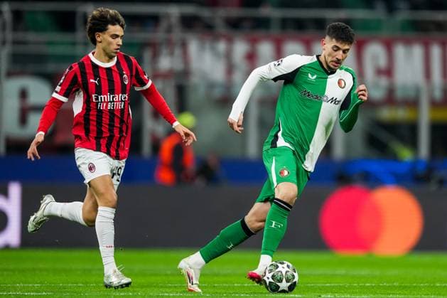 UEFA Champions League: AC Milan v Feyenoord Milan - Joao Felix of AC Milan, Jakub Moder of Feyenoord during the 2nd leg of the knockout phase play-offs of new format of the Champions League 2024 2025. The match is set between AC Milan and Feyenoord at Giuseppe Meazza San Siro on 18 February 2025 in Milan, Italy. Copyright: xTomxBodex