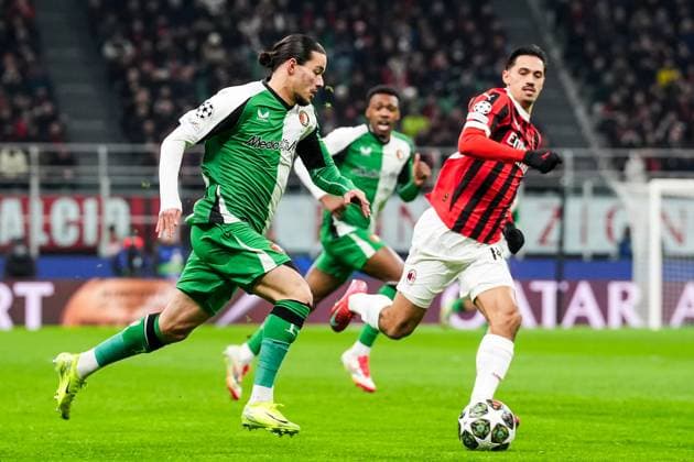 UEFA Champions League: AC Milan v Feyenoord Milan - Anis Hadj Moussa of Feyenoord, Tijjani Reijnders of AC Milan during the 2nd leg of the knockout phase play-offs of new format of the Champions League 2024 2025. The match is set between AC Milan and Feyenoord at Giuseppe Meazza San Siro on 18 February 2025 in Milan, Italy. Copyright: xTomxBodex