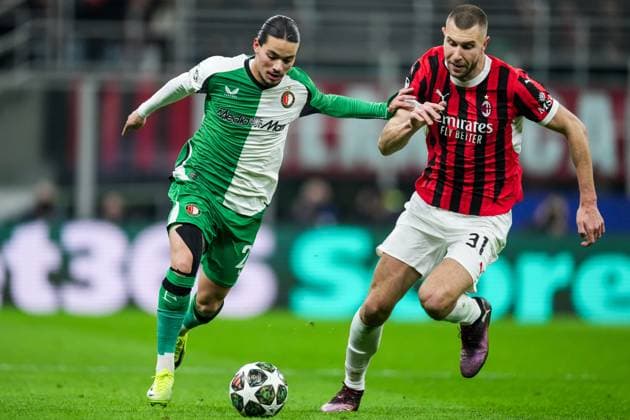 UEFA Champions League: AC Milan v Feyenoord Milan - Anis Hadj Moussa of Feyenoord, Strahinja Pavlovic of AC Milan during the 2nd leg of the knockout phase play-offs of new format of the Champions League 2024 2025. The match is set between AC Milan and Feyenoord at Giuseppe Meazza San Siro on 18 February 2025 in Milan, Italy. Copyright: xTomxBodex
