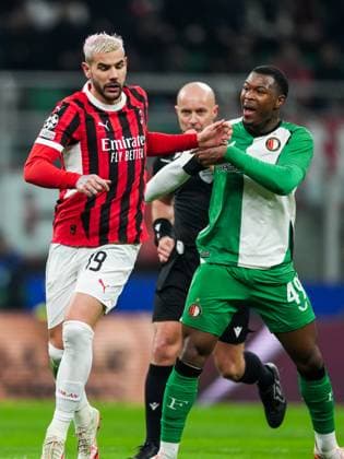 UEFA Champions League: AC Milan v Feyenoord Milan - Theo Hernandez of AC Milan, Zepiqueno Redmond of Feyenoord during the 2nd leg of the knockout phase play-offs of new format of the Champions League 2024 2025. The match is set between AC Milan and Feyenoord at Giuseppe Meazza San Siro on 18 February 2025 in Milan, Italy. Copyright: xTomxBodex
