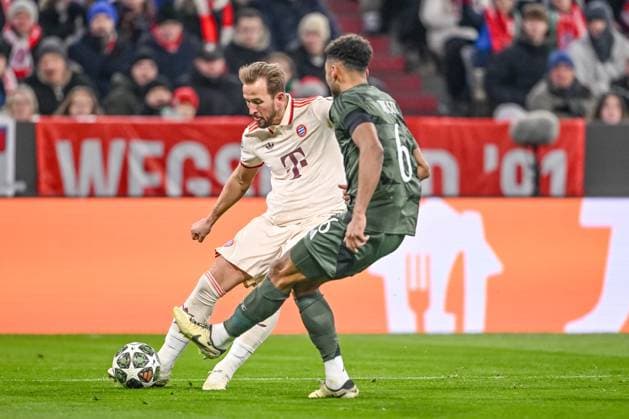 Harry Kane FC Bayern Muenchen and Auston Trusty Celtic FC battle for the ball during the UEFA Champions League 2024 25 League Knockout Play off Second Leg match between FC Bayern München and Celtic FC at Allianz Arena on February 18, 2025 in Munich, Germany Photo by Harry Langer DeFodi Images Defodi 541 FCBCFC0250218 15 Defodi-541