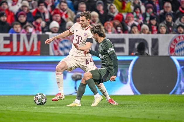 Josip Stanisic FC Bayern Muenchen and Jota Celtic FC battle for the ball during the UEFA Champions League 2024 25 League Knockout Play off Second Leg match between FC Bayern München and Celtic FC at Allianz Arena on February 18, 2025 in Munich, Germany Photo by Harry Langer DeFodi Images Defodi 541 FCBCFC0250218 16 Defodi-541
