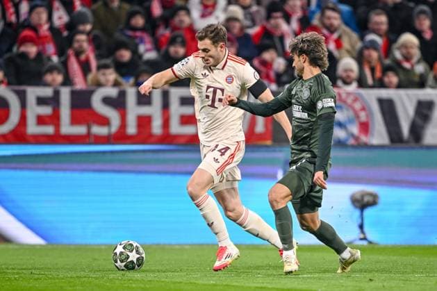 Josip Stanisic FC Bayern Muenchen and Jota Celtic FC battle for the ball during the UEFA Champions League 2024 25 League Knockout Play off Second Leg match between FC Bayern München and Celtic FC at Allianz Arena on February 18, 2025 in Munich, Germany Photo by Harry Langer DeFodi Images Defodi 541 FCBCFC0250218 17 Defodi-541