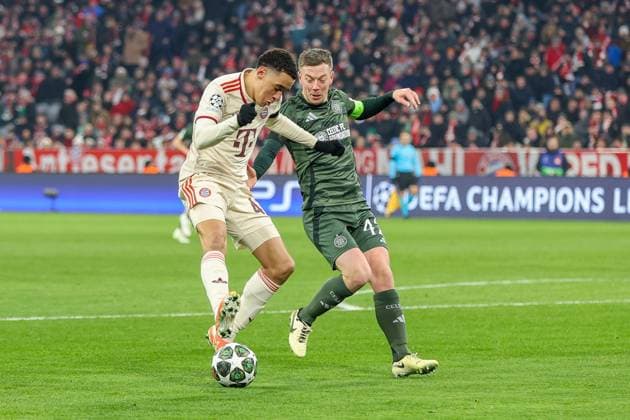 in duel, action, with Jamal Musiala 42 FC Bayern Muenchen , Callum McGregor 42 Celtic Glasgow , FC Bayern Muenchen vs Celtic Glasgow, Football, Champions League, Play offs, second leg, 18 02 2025 Muenchen Bayern Germany Copyright: xkolbert-press ChristianxKolbertx