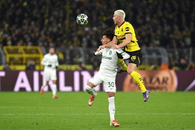 Biel Sporting Lisbon and Julian Ryerson Borussia Dortmund in a duel during the UEFA Champions League 2024 25 League Play offs Second Leg match between Borussia Dortmund and Sporting Lisbon, SIGNAL IDUNA PARK on February 19, 2025 in Dortmund, Germany, Germany Photo by Ralf Treese DeFodi Images Biel Sporting Lisbon and Julian Ryerson Borussia Dortmund battle for the ball during the UEFA Champions League 2024 25 League Knockout Play off Second Leg match between Borussia Dortmund and Sporting Clube de Portugal at Signal Iduna Park on February 19, 2025 in Dortmund, Germany Photo by Ralf Treese DeFodi Images Defodi-521