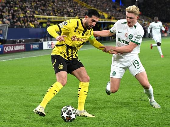 Emre Can Borussia Dortmund and Conrad Harder Sporting Lisbon in a duel during the UEFA Champions League 2024 25 League Play offs Second Leg match between Borussia Dortmund and Sporting Lisbon, SIGNAL IDUNA PARK on February 19, 2025 in Dortmund, Germany, Germany Photo by Ralf Treese DeFodi Images Emre Can Borussia Dortmund and Conrad Harder Sporting Lisbon battle for the ball during the UEFA Champions League 2024 25 League Knockout Play off Second Leg match between Borussia Dortmund and Sporting Clube de Portugal at Signal Iduna Park on February 19, 2025 in Dortmund, Germany Photo by Ralf Treese DeFodi Images Defodi-521