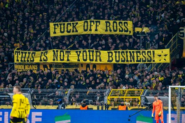19 02 2025, Borussia Dortmund vs Sporting Lisbon, UEFA Champions League, play-off second leg The Dortmund fans in the south stand display a banner with the inscription Fuck off Ross, this is not your Business Important note In accordance with UEFA regulations, it is prohibited to use or have used photographs taken in the stadium and or of the match in the form of sequential images and or video-like photo series Copyright: xBahhoxKarax
