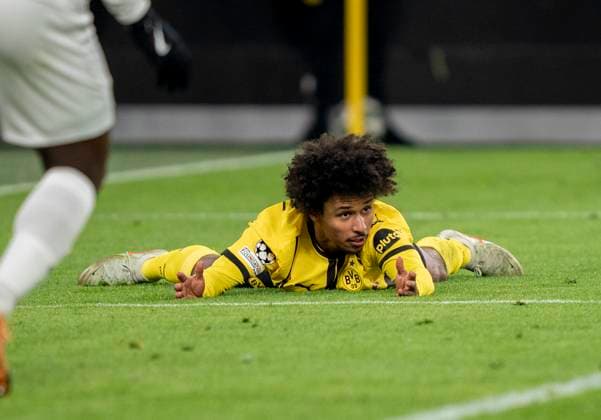 Karim Adeyemi Borussia Dortmund, 27 lies on the ground after a foul in the penalty area Borussia Dortmund vs Sporting CP Lisbon, Football, UEFA Champions League, Play Offs, Second leg, Season 2024 2025, 19 02 2025 DFL regulations prohibit any use of photographs as image sequences and or quasi video Copyright: HMBxMedia xMarcoxBader